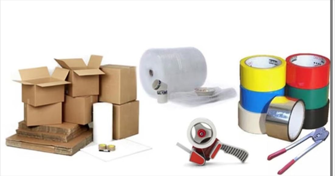Packing materials used for relocation: cartons, bubble wrap rolls, adhesive tapes and a tape dispenser